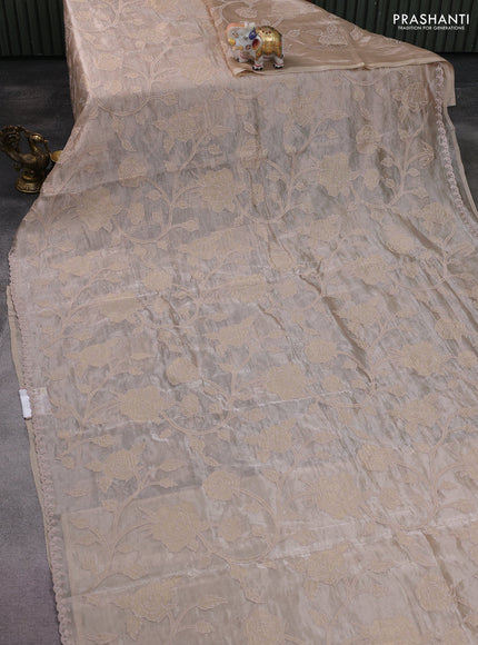 Pure tissue silk saree beige with allover floral embroidery applique work and embroidery scallop border