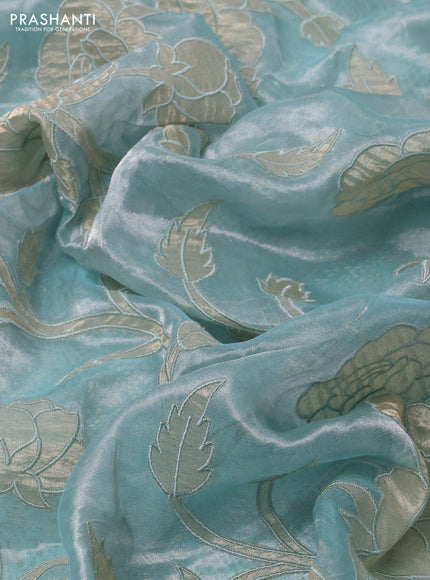 Pure tissue silk saree teal blue with allover floral embroidery applique work and embroidery scallop border