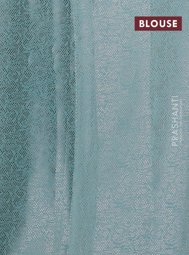 Pure tissue silk saree teal blue with allover floral embroidery applique work and embroidery scallop border