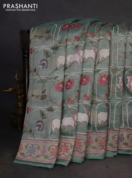 Pure tissue silk saree pista green shade with allover pichwai embroidery work and embroidery border