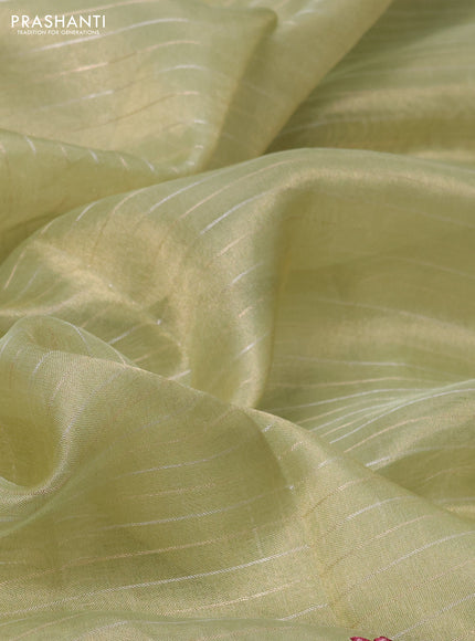 Pure tissue silk saree pastel green with allover zari stripe pattern and covent embroidery border
