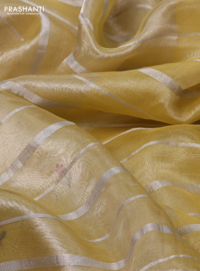 Pure tissue silk saree pale yellow with allover silver zari strip pattern & beaded work and embroidery border