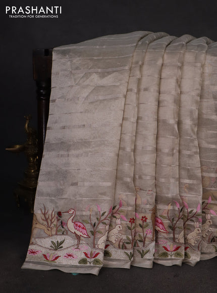 Pure tissue silk saree pastel grey with allover silver zari strip pattern & beaded work and embroidery border