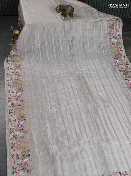 Pure tissue silk saree pastel grey with allover silver zari strip pattern & beaded work and embroidery border