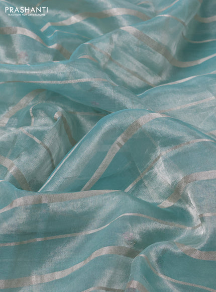 Pure tissue silk saree teal blue with allover silver zari strip pattern & beaded work and embroidery border