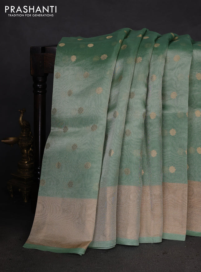 Pure tissue silk saree teal green shade with allover zari woven buttas and zari woven border