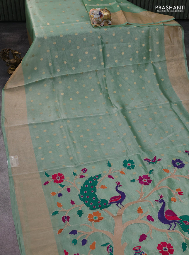 Pure tissue silk saree teal green shade with allover zari woven buttas and zari woven border