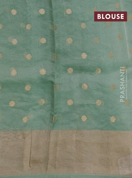 Pure tissue silk saree teal green shade with allover zari woven buttas and zari woven border