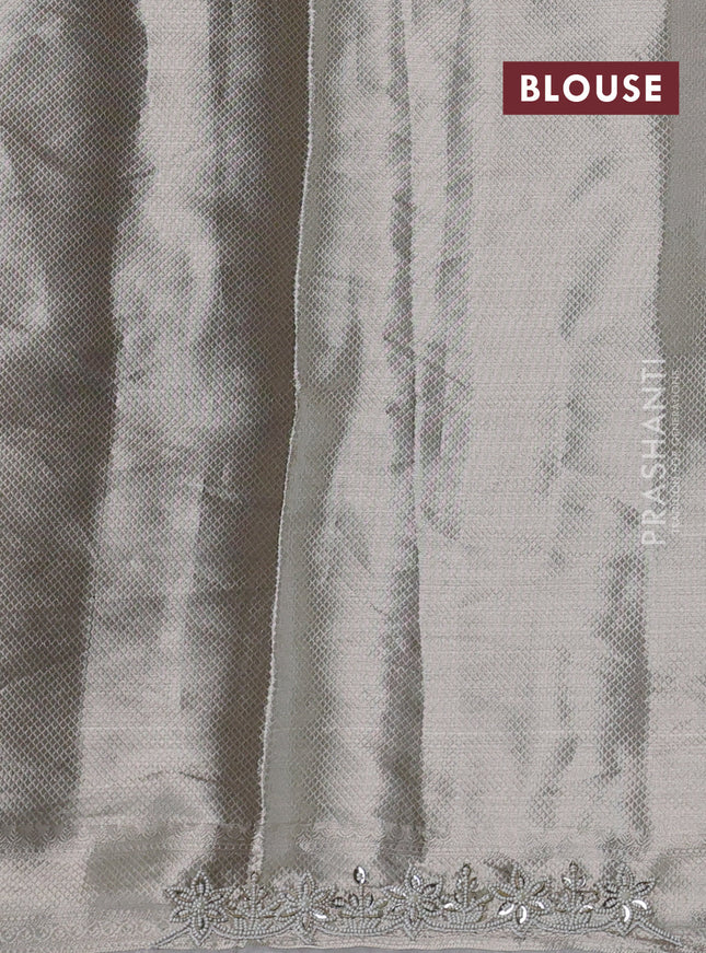 Pure tissue silk saree off white with allover zari woven brocade weaves & beaded work and beaded work border