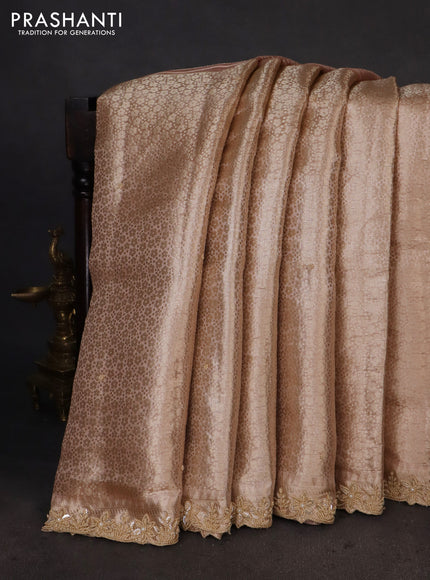 Pure tissue silk saree peach shade with Half & half style zari weaves and beaded work border