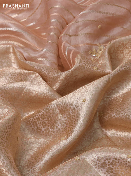 Pure tissue silk saree peach shade with Half & half style zari weaves and beaded work border