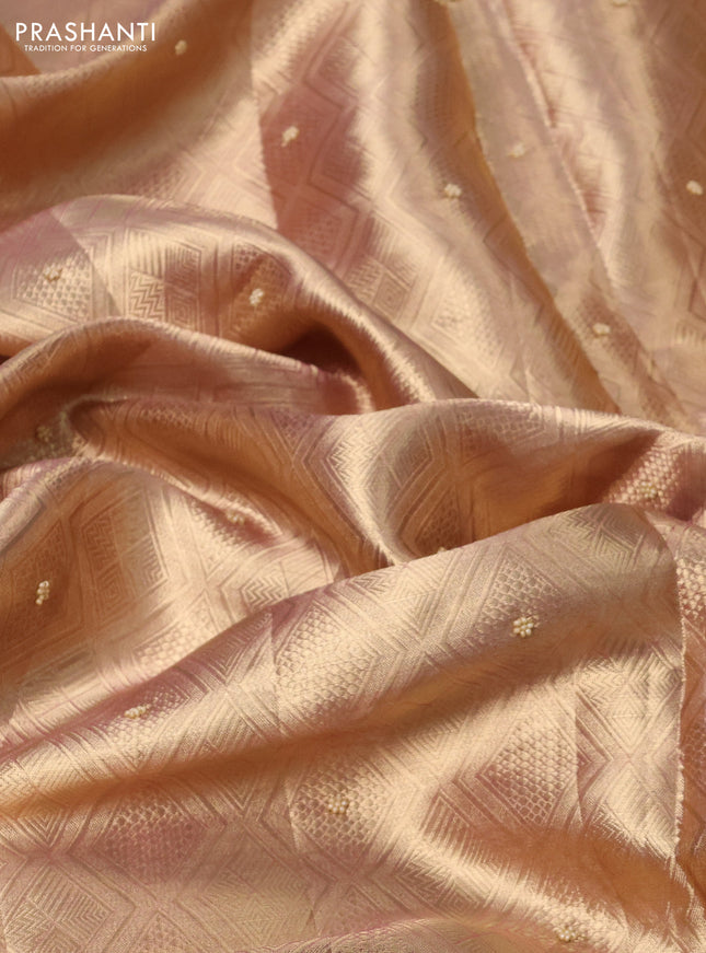 Pure tissue silk saree dual shade of pinkish gold with allover zari woven brocade weaves & beaded work and beaded work border