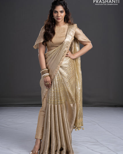 Pure tissue silk saree beige with Half & half style zari weaves and beaded work border