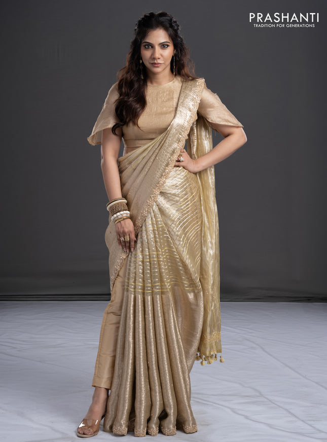 Pure tissue silk saree beige with Half & half style zari weaves and beaded work border