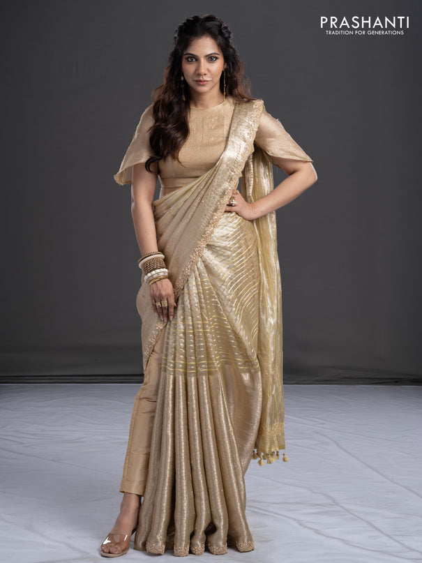 Pure tissue silk saree beige with Half & half style zari weaves and beaded work border