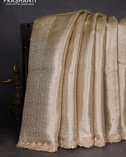 Pure tissue silk saree beige with Half & half style zari weaves and beaded work border