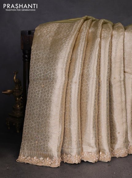 Pure tissue silk saree pista green with Half & half style zari weaves and beaded work border