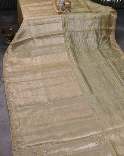Pure tissue silk saree beige with Half & half style zari weaves and beaded work border