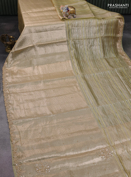 Pure tissue silk saree pista green with Half & half style zari weaves and beaded work border