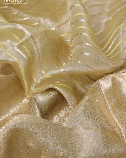 Pure tissue silk saree beige with Half & half style zari weaves and beaded work border