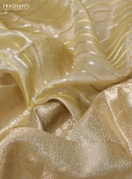 Pure tissue silk saree pista green with Half & half style zari weaves and beaded work border