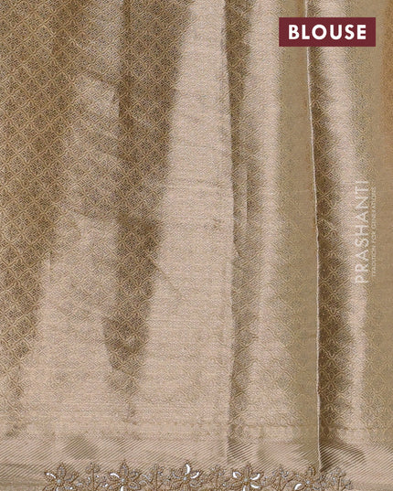 Pure tissue silk saree beige with Half & half style zari weaves and beaded work border