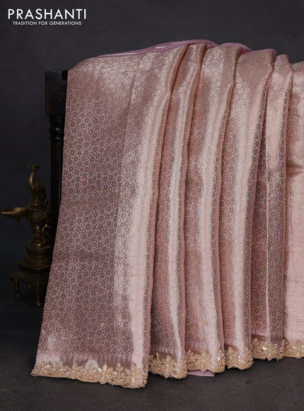 Pure tissue silk saree pastel peach pink with Half & half style zari weaves and beaded work border