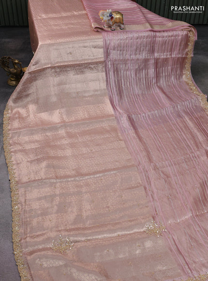 Pure tissue silk saree pastel peach pink with Half & half style zari weaves and beaded work border