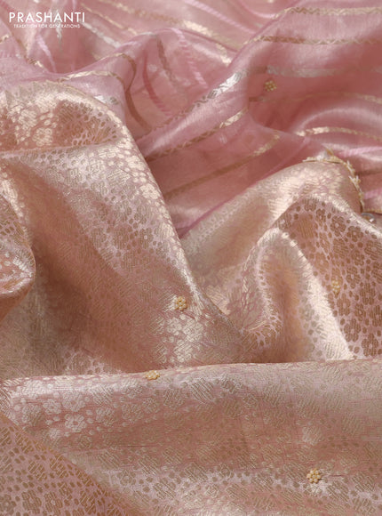 Pure tissue silk saree pastel peach pink with Half & half style zari weaves and beaded work border