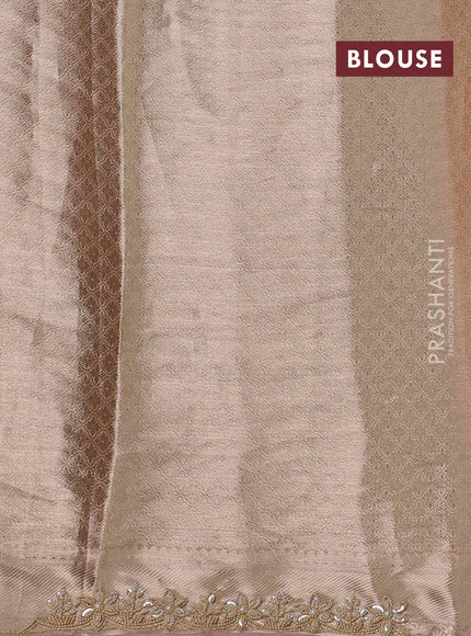 Pure tissue silk saree pastel peach pink with Half & half style zari weaves and beaded work border