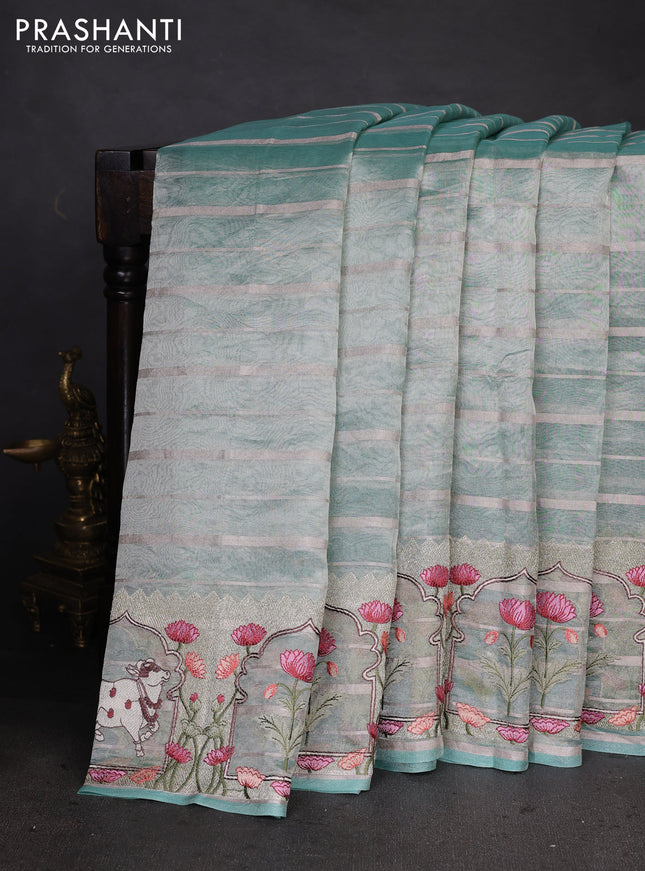 Pure tissue silk saree teal blue with allover silver zari strip pattern & beaded work and pichwai embroidery border