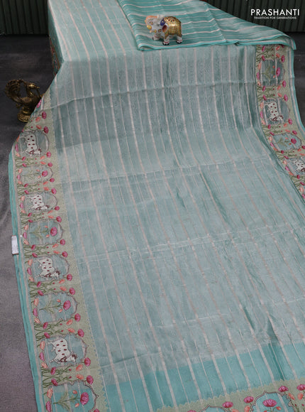 Pure tissue silk saree teal blue with allover silver zari strip pattern & beaded work and pichwai embroidery border