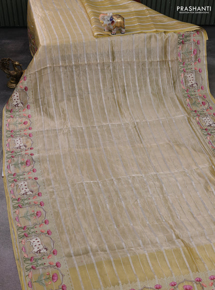 Pure tissue silk saree pale yellow with allover silver zari strip pattern & beaded work and pichwai embroidery border