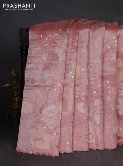 Pure tissue silk saree peach shade with allover floral embroidery work and simple embroidery border