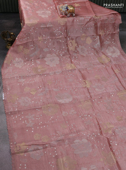 Pure tissue silk saree peach shade with allover floral embroidery work and simple embroidery border