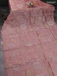 Pure tissue silk saree peach shade with allover floral embroidery work and simple embroidery border