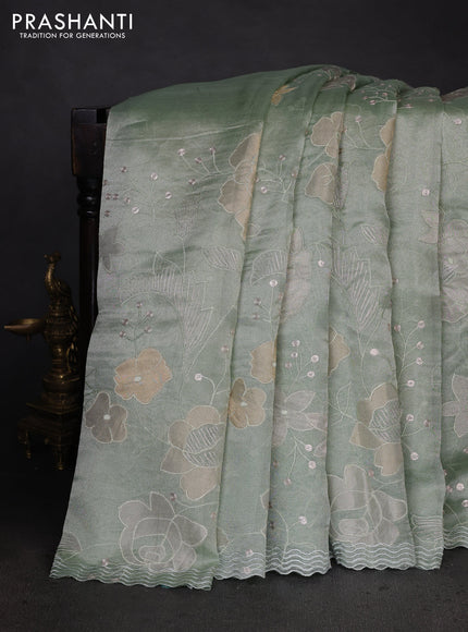 Pure tissue silk saree pastel green with allover floral embroidery work and simple embroidery border