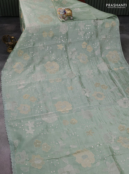 Pure tissue silk saree pastel green with allover floral embroidery work and simple embroidery border