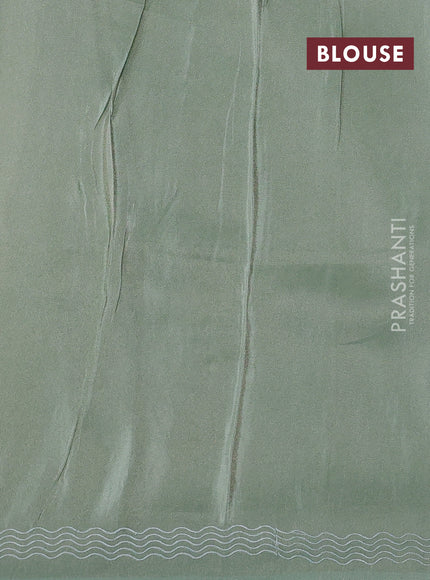 Pure tissue silk saree pastel green with allover floral embroidery work and simple embroidery border