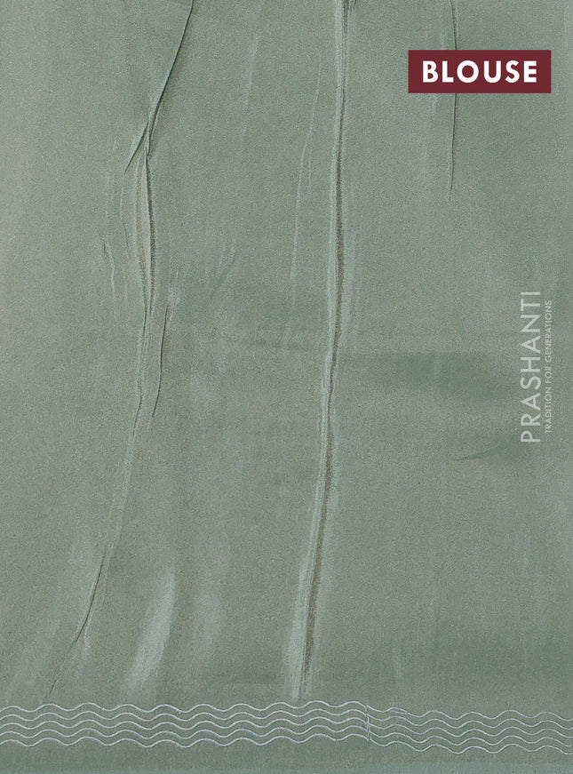 Pure tissue silk saree pastel green with allover floral embroidery work and simple embroidery border