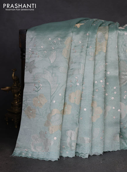 Pure tissue silk saree pastel blue with allover floral embroidery work and simple embroidery border