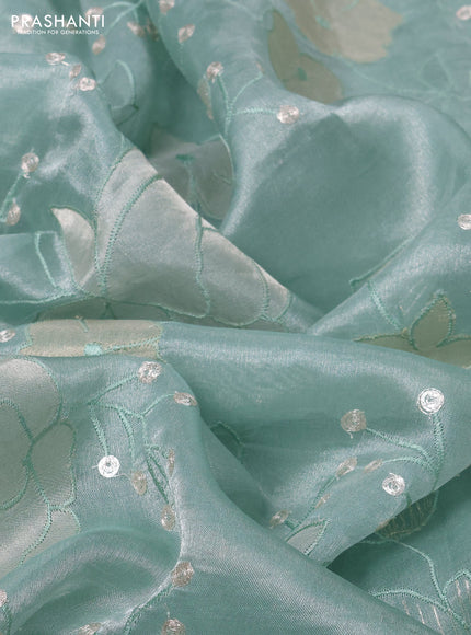 Pure tissue silk saree pastel blue with allover floral embroidery work and simple embroidery border