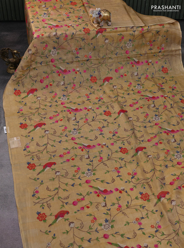 Pure tissue silk saree gold with allover convent embroidery work and simple border