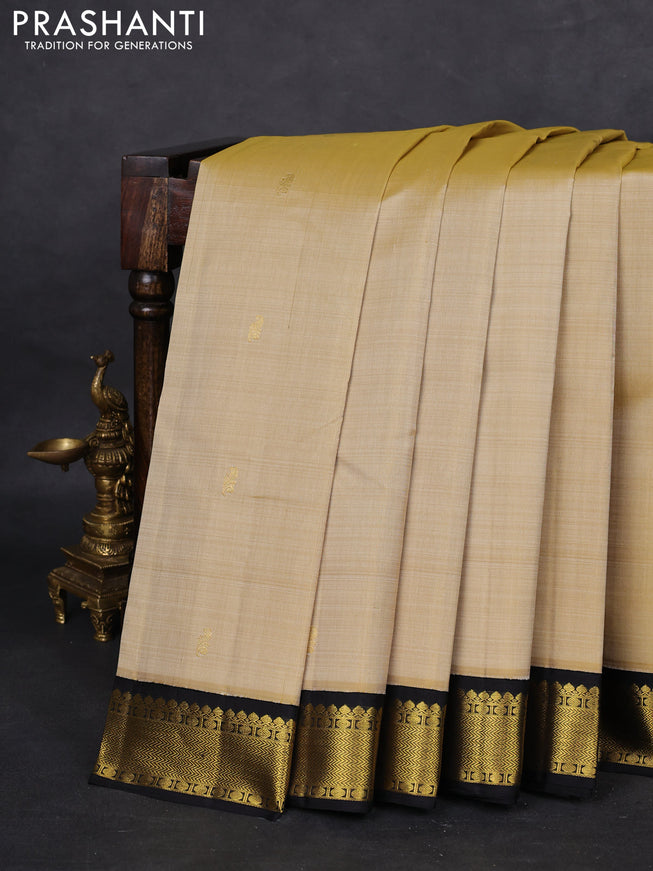Pure kanchipuram silk saree cream and black with zari woven buttas and zari woven korvai border