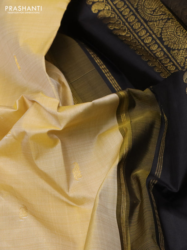Pure kanchipuram silk saree cream and black with zari woven buttas and zari woven korvai border