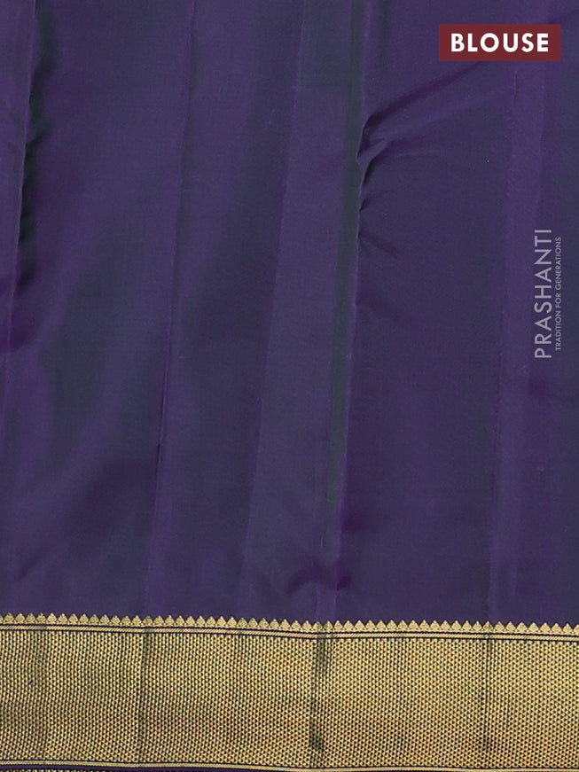 Pure kanchipuram silk saree dual shade of greenish violet with allover zari woven buttas and zari woven border