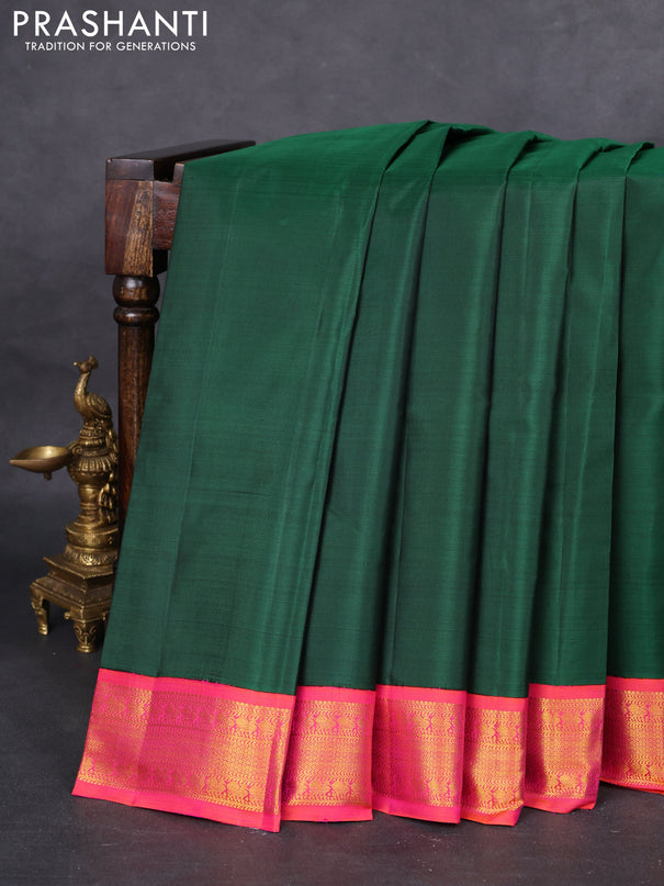 Pure kanchipuram silk saree green and dual shade of pinkish orange with plain body and zari woven korvai border