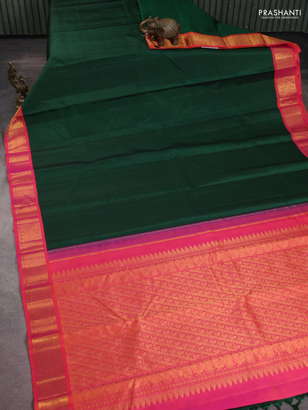 Pure kanchipuram silk saree green and dual shade of pinkish orange with plain body and zari woven korvai border