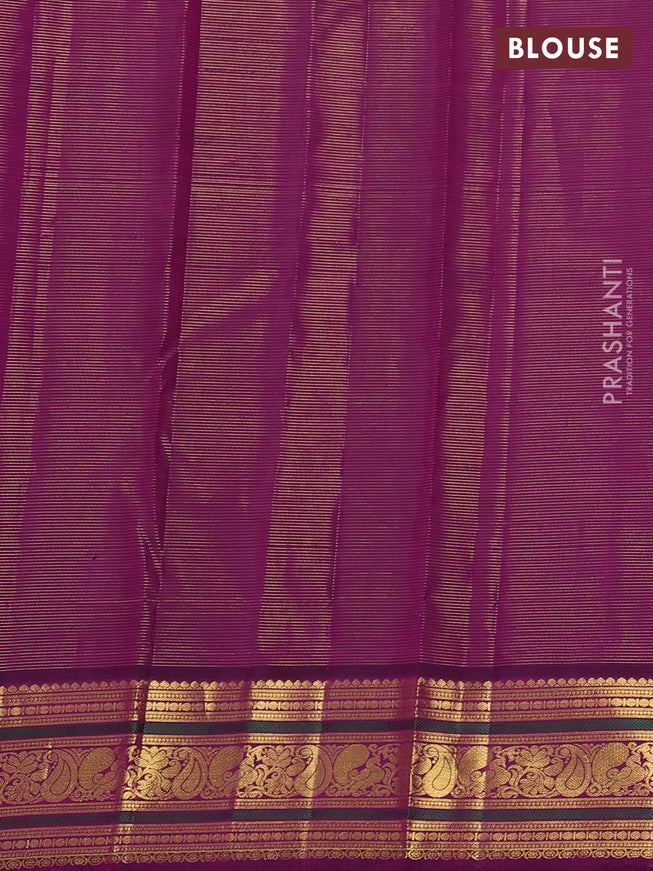 Pure kanchipuram silk saree mild pista green and purple with allover zari woven stripe pattern and zari woven korvai border