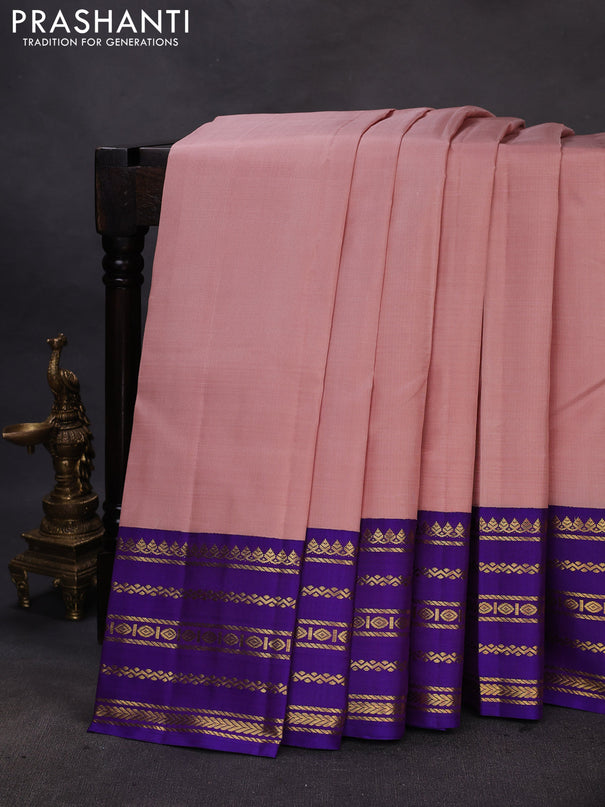 Pure kanchipuram silk saree pastel peach and violet with plain body and rich zari woven korvai border
